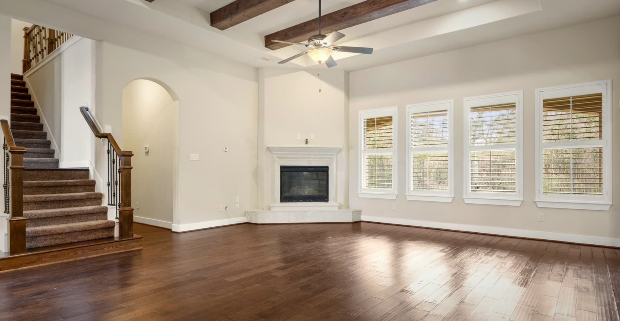 Bear Builders living room with fireplace and staircase
