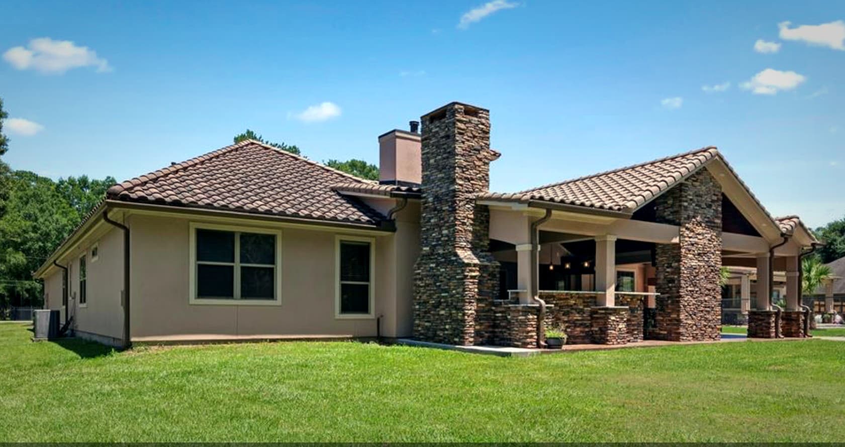 Bear Builders stone ranch-style custom home